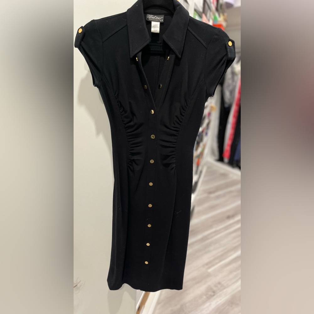 Black Stretch Dress with side zipper and faux gold buttons. Size 2.